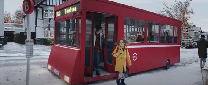 Screenshot from the John Lewis advert of a girl getting off a bus